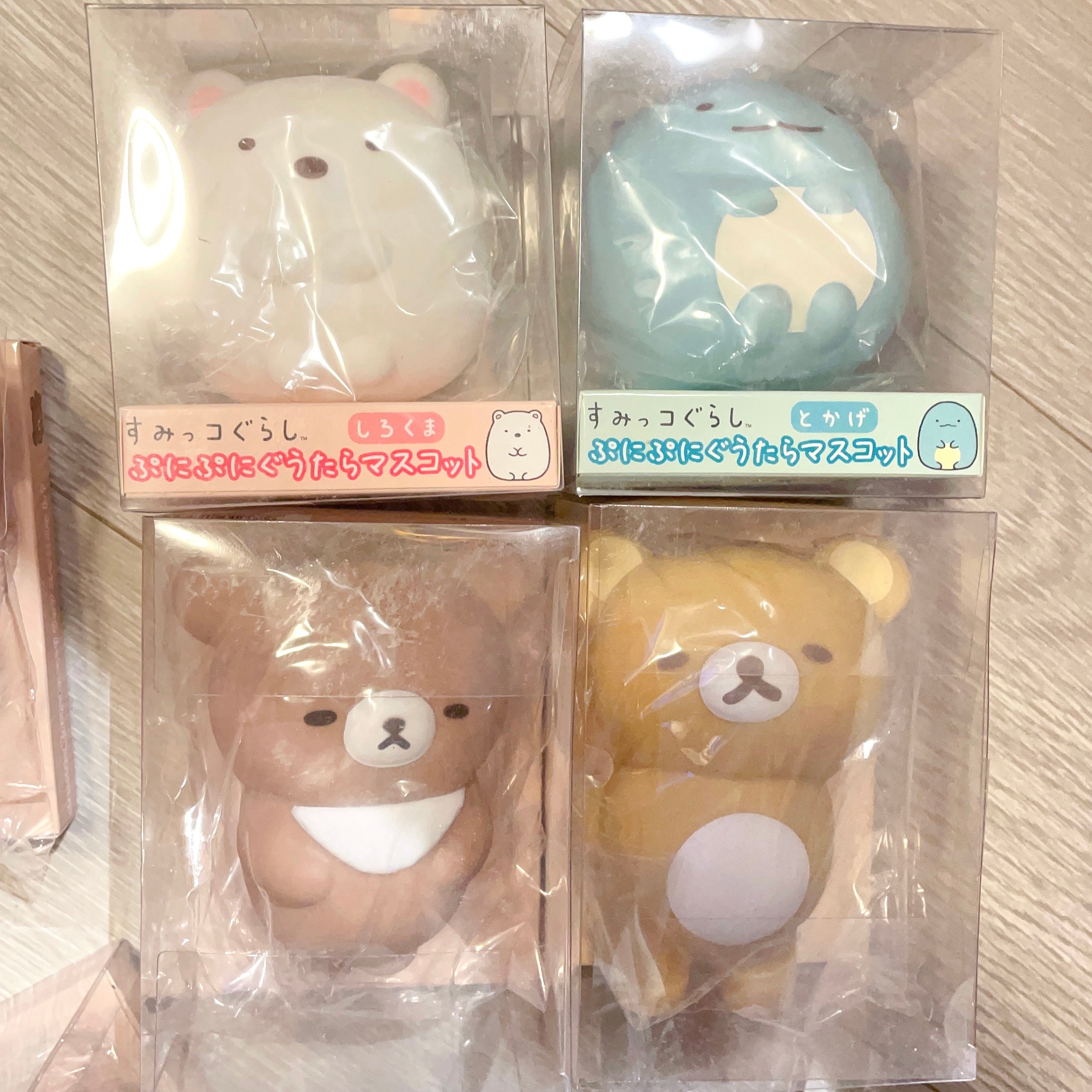 Rilakuma and Sumikko squeeze